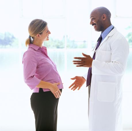 Doctor talking to female patient