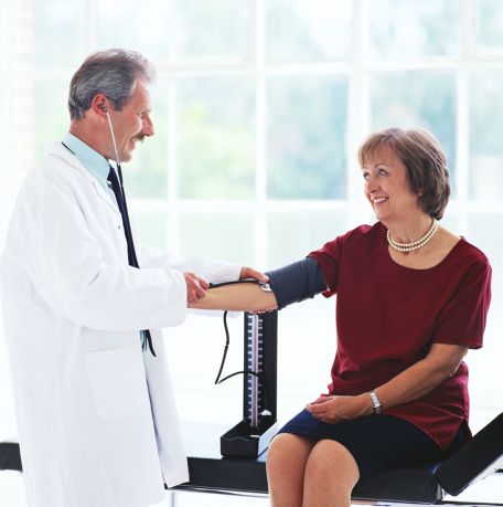 Doctor Taking Patient's Blood Pressure