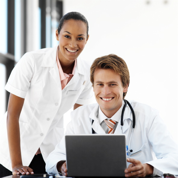 Male and Female Physicians at Computer
