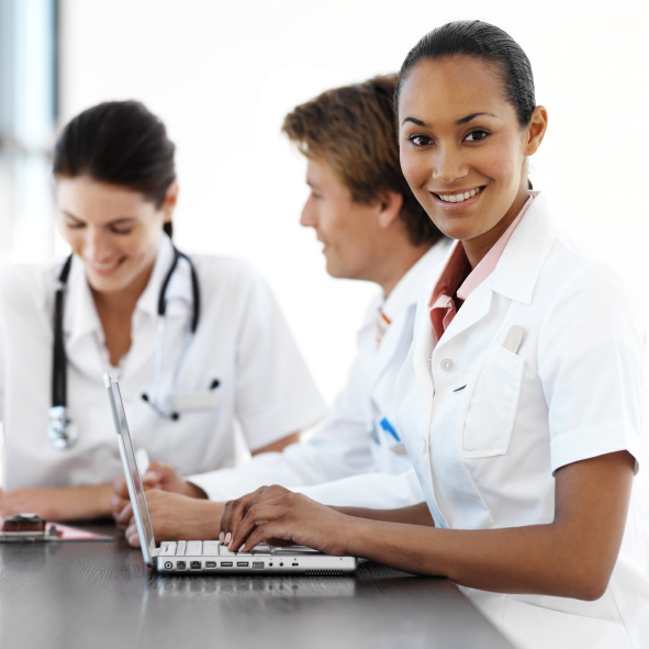 Three Physicians Working at Nurses' Station