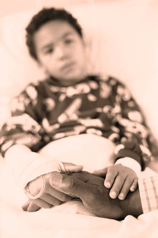 Child patient in medical bed