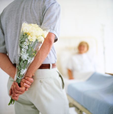 Man Giving Patient Flowers