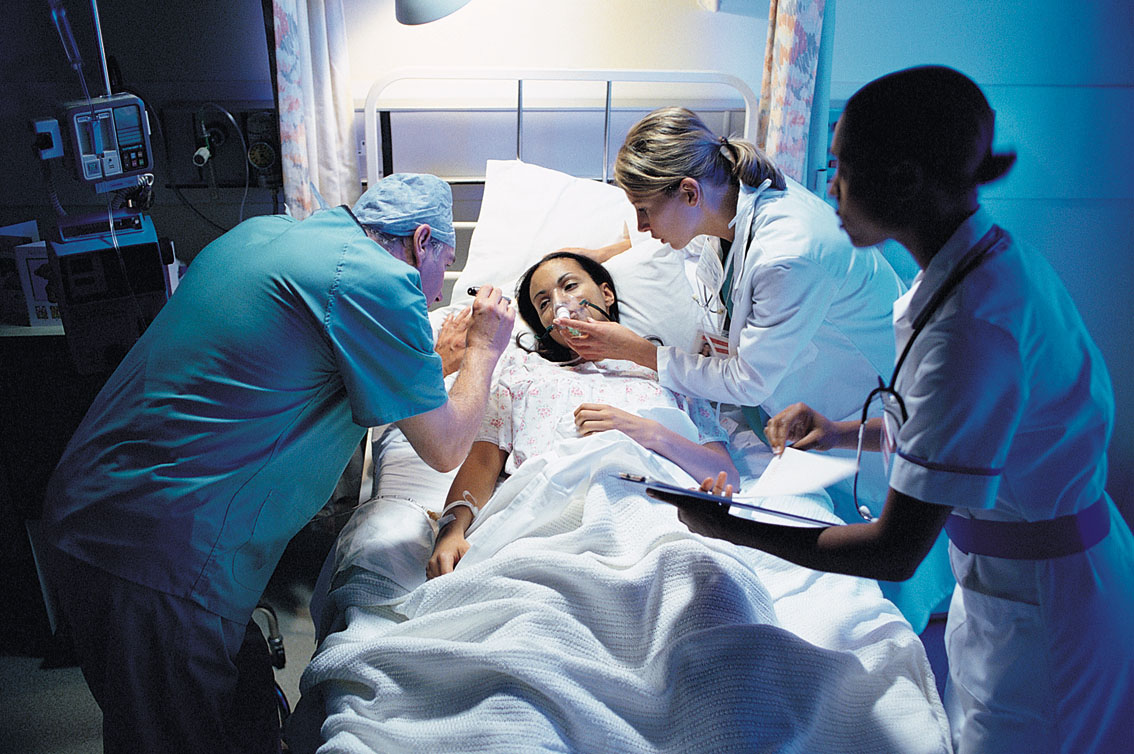 Care team around patient in hospital